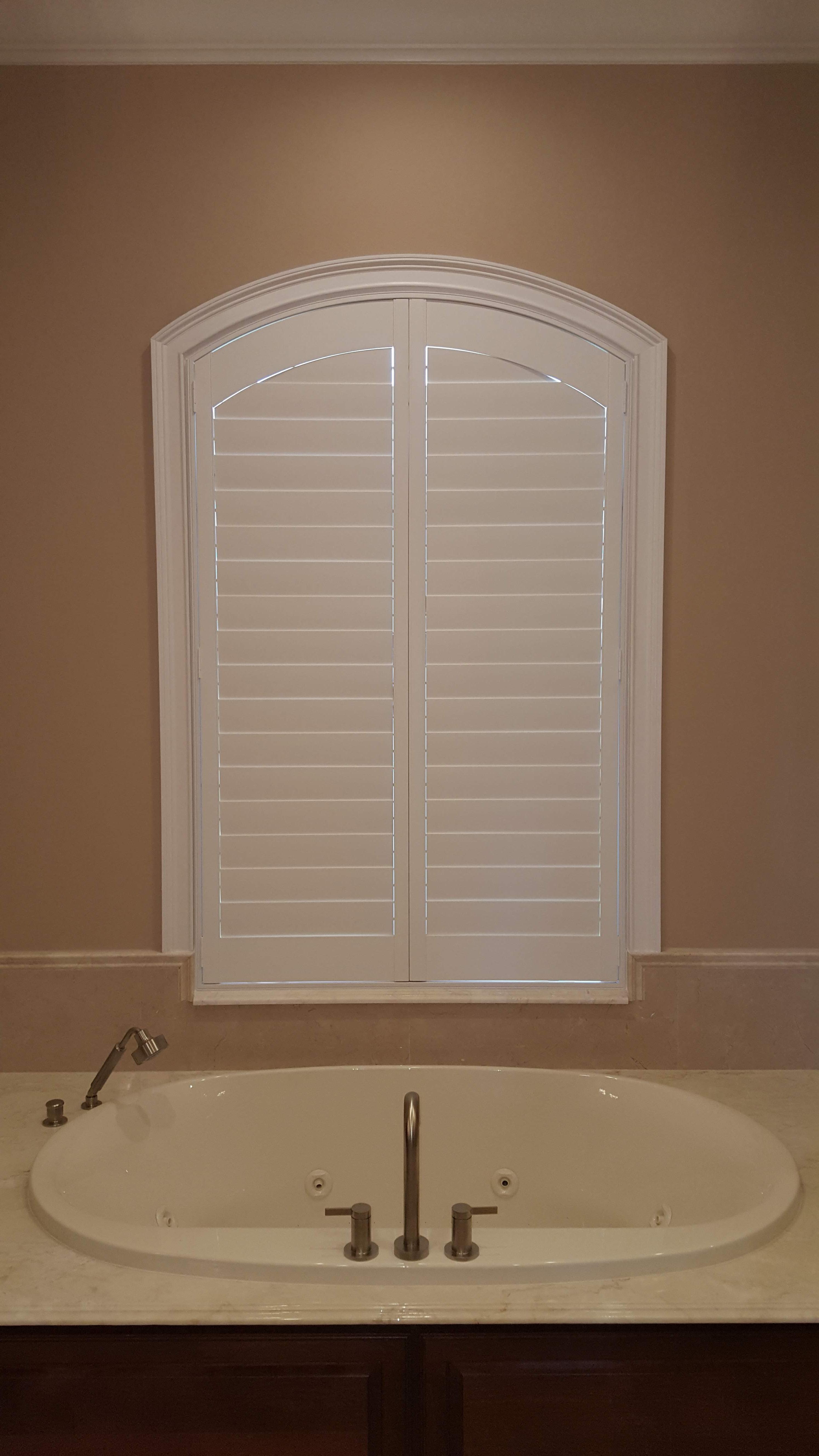 Vinyl plantation shutters in bathroom